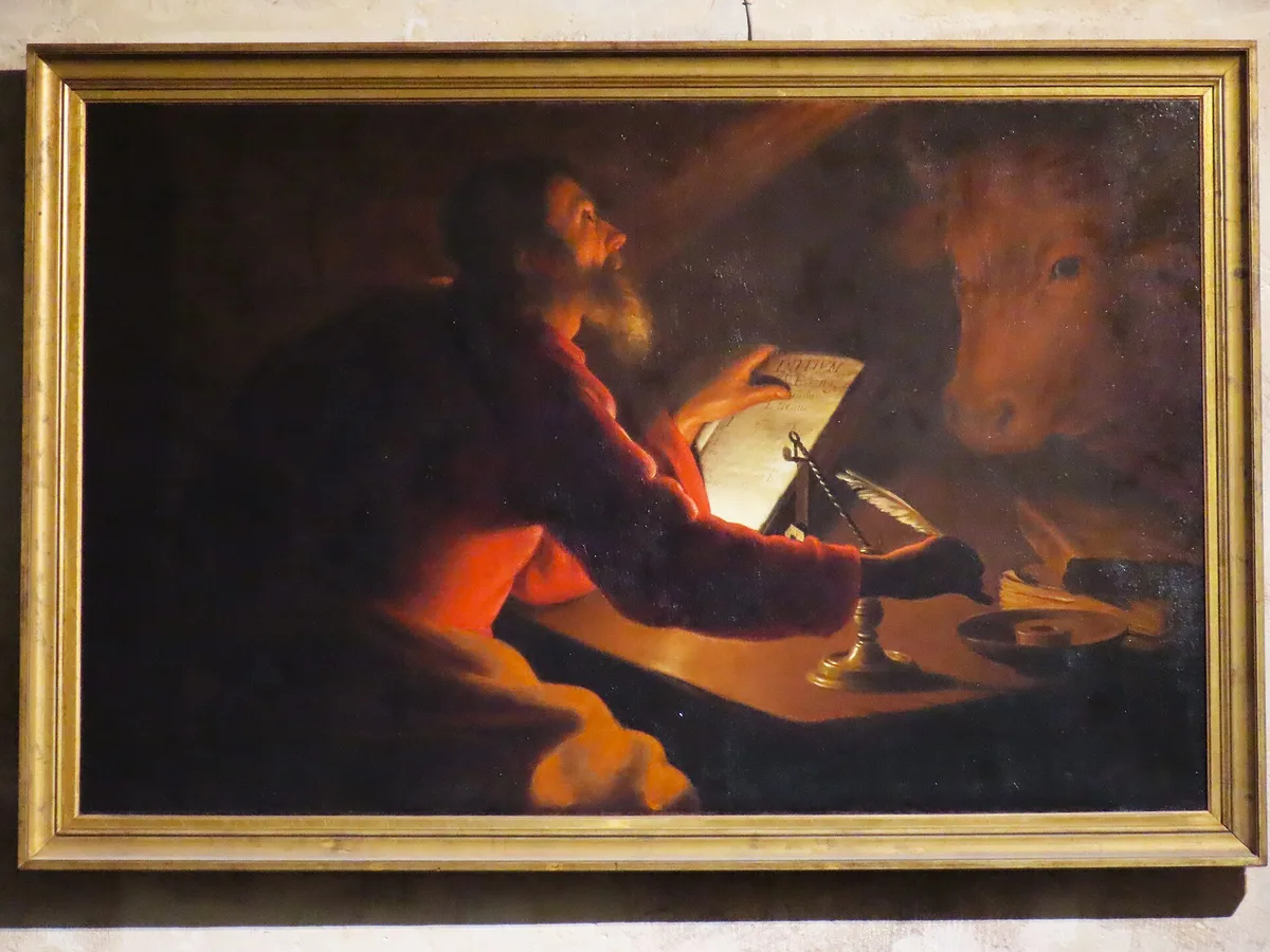 Pintura de São Lucas escrevendo seu Evangelho, ao lado do touro, símbolo do evangelista